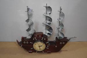 lot 255 image: United Self Starting Clock in MCM Wood and Metal Ship