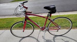 lot 194 image: Red Specialized Roulux Bike with Extra Seat and Helmet