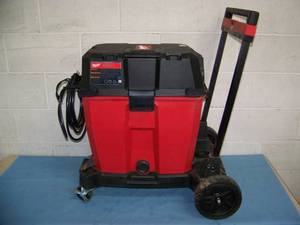lot 1 image: Milwaukee Tool 6.5 Peak HP Wet  Dry Vacuum with 12-Gallon Vac Tank and Rolling Dolly  Mobile Cart