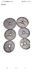 lot 4 image: Unbranded 2 Weight Plates. See Pictures ( Two 45LB, Two 35LB and Two 25LB. Storage rack Not Included)