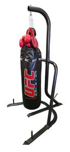 lot 43 image: 3XL Heavy-duty UFC- As Real as it Gets Punch Bag with a stand, a pair of Everlast boxing gloves, and a pair of protected gear.