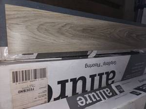 lot 68 image: 9 boxes alpine elm gripstrip vinyl plank flooring