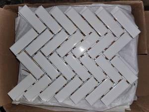 lot 138 image: Arctic white herringbone mosaic tile