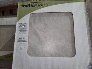 lot 189 image: 6 boxes Portland sand grey 18x18 tile