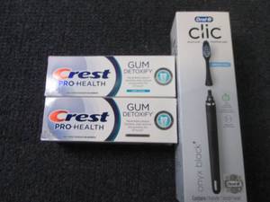 lot 103 image: Oral B Clic Toothbrush, 2 tubes Cre...