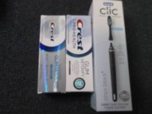 lot 104 image: Oral B Clic Toothbrush, 2 tubes Cre...