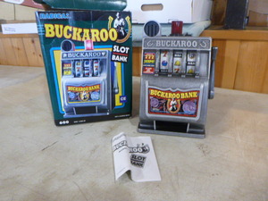 lot 180 image: Vintage Radica Buckaroo Slot Bank