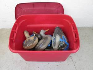 lot 162 image: Covered tote containing duck decoys...