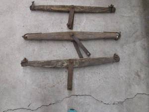 lot 188 image: (3) Primitive barnwood ox yokes wit...