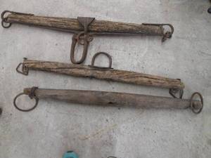 lot 189 image: (3) Primitive barnwood ox yokes wit...