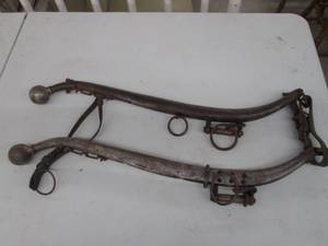 lot 193 image: (2) Vintage steel ox yokes with lea...