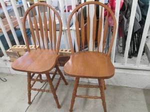 lot 209 image: Pair of wood high-back swiveling st...