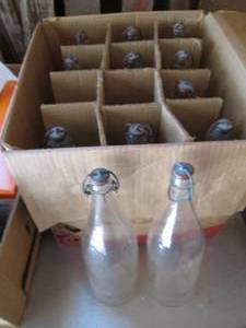 lot 42 image: Box of Vintage glass soda-style bot...