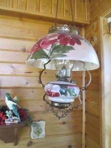 lot 312 image: Hanging oil lamp and wall decor...