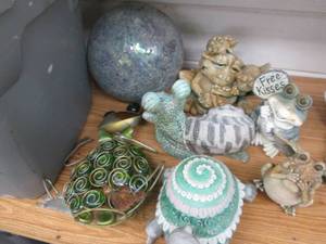 lot 291 image: Garden decor and a gazing ball...