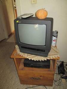 lot 332 image: Panasonic TV with built in VHS play...
