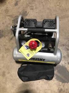 lot 6 image: Husky 1 Gal. 135 PSI Portable Electric Quiet Air Compressor  Customer Returns See Pictures