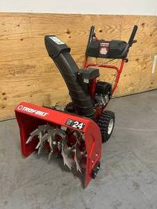 lot 1 image: TROY-BILT Storm 24 in. 208 cc Two- Stage Gas Snow Blower with Electric Start Self Propelled