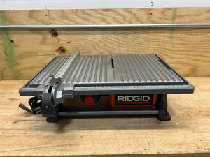 lot 26 image: RIDGID 6.5-Amp 7 in. Blade Corded Table Top Wet Tile Saw