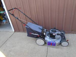 Murray push mower with bagger. Nearly new. Tested & works. As shown.