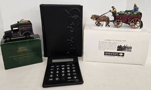 lot 47 image: Department 56 Collectible Village Accessories and Logo Dictionary & Calculator
