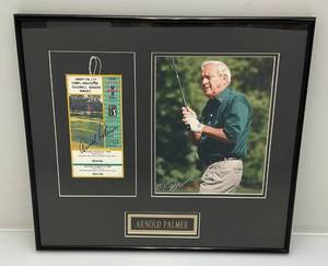 lot 2 image: Arnold Palmer Signed Ticket Stub & Photo Framed Behind Glass 16 x 18