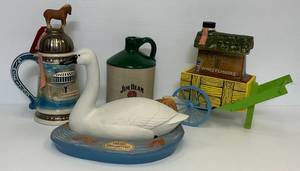 lot 23 image: Misc. Collectible Jim Beam Decanters Including 1 Of 20 Green Glaze Jug,  Ducks Unlimited & More (Empty)