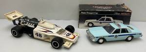 lot 141 image: Jim Beam Indy Car & Blue Police Car Decanters (EMPTY)