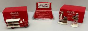 lot 243 image: Misc. Department 56 Snow Village COCA-COLA Collectors Items (All In Original Boxes)