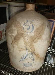 lot 68 image: Red Wing stoneware jug 5 gallon cracked and was glued back together at one time
