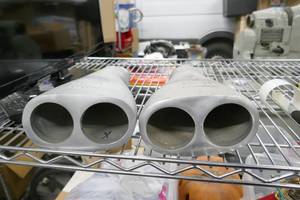 lot 138 image: Box of Pontiac Grand Prix exhaust tips