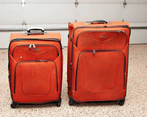 lot 199 image: Two Burnt Orange Suitcases