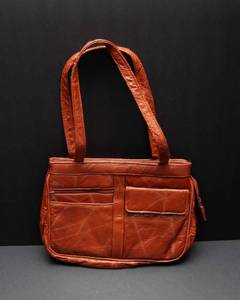 lot 149 image: An Ambassador Design Brown Purse