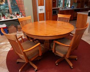 lot 237 image: Maple Kitchen Table and Four Rolling Dining Chairs by Canadel Furniture Inc.