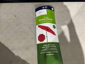 lot 377 image: Mainstays 9ft Really Red Round Outdoor Tilting Market Patio Umbrella with Crank