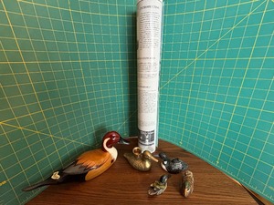 Wooden Duck, Duck Posters, and a Brass Duck Candleholder