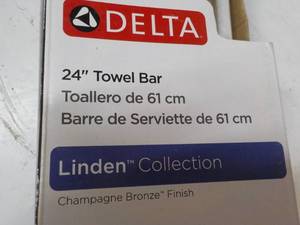 lot 60 image: Delta 24 Towel Bar Gold Tones...