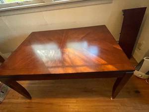 lot 51 image: Elegant Wooden Dining Table with Leaf Extension - Mahogany Finish