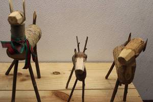 lot 33 image: Set of 3 Handcrafted Wooden Reindeer Figurines