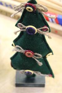 lot 103 image: Holiday Decor Collection including Miniature Trees, Ornaments, and Sign
