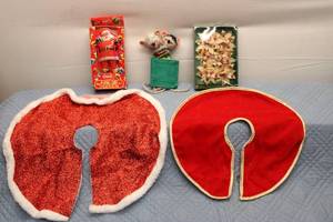 lot 52 image: Assorted Vintage Christmas Decorations Including Santa Cards, Christmas Tree Skirts, and Floral Ornaments