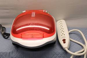 lot 215 image: George Foreman Lean Mean Fat-Reducing Grilling Machine with Belkin Surge Protector