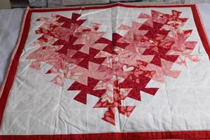 lot 14 image: Handmade Quilted Heart Throw Blanket in Red and Pink Patterns