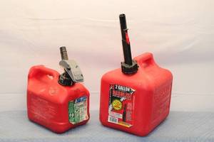 lot 112 image: Set of 2 Red Gasoline Canisters with Spill-Proof Systems