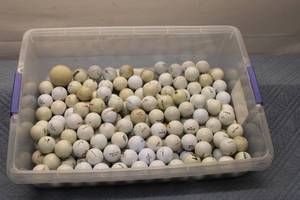 lot 150 image: Collection of 100 Used Golf Balls in Storage Container