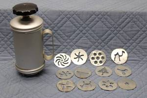 lot 220 image: Vintage Aluminum Cookie Press with 12 Metal Discs