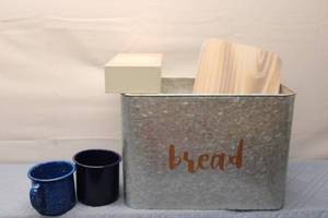 lot 241 image: Rustic Kitchen Collection Bread Box, Wooden Cutting Board, and Two Enamel Mugs