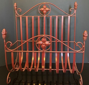lot 101 image: Unique Dark Red Metal Magazine Rack