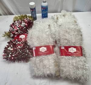lot 81 image: White Tinsel Garland, SilverRed & Gold-1 Can Santa Snow(missing cap) & 1 can Santa Ice Crystals(Frost)
