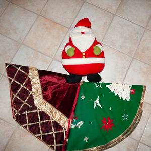 lot 325 image: Tree Skirts and a Plush Santa